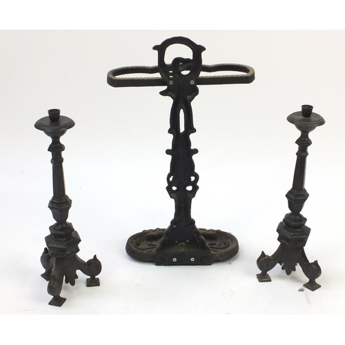 729 - Cast iron stick stand and pair of candlesticks