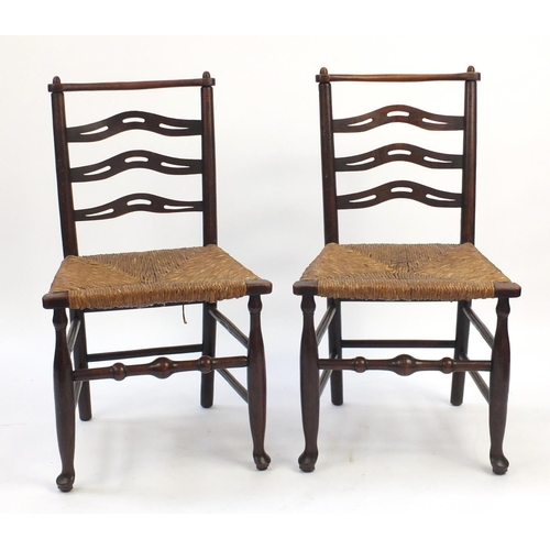59 - Pair of mahogany ladder back chairs with cane seats