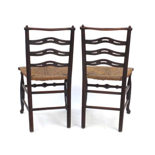 59 - Pair of mahogany ladder back chairs with cane seats