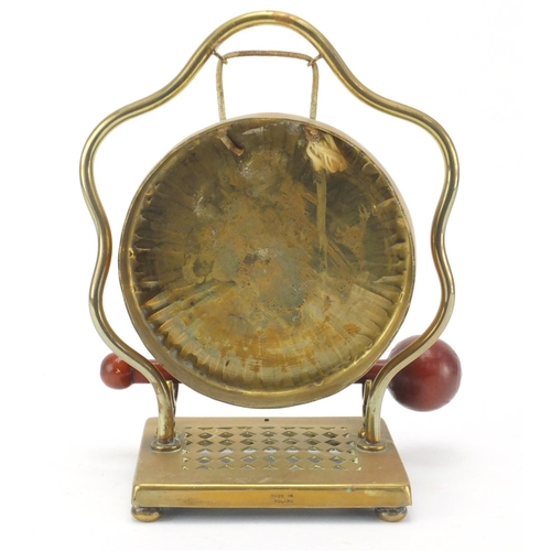 145 - Brass table gong, 22cm high