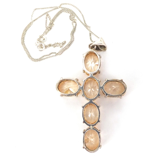 296 - Large silver quartz cross pendant on a silver necklace, the pendant 7cm in length