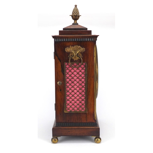 2047 - Regency rosewood bracket clock with brass inlay, fretwork panels and pineapple finial, the eight day... 