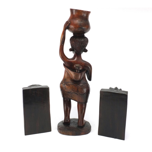 142 - African carved hardwood figure and pair of bookends