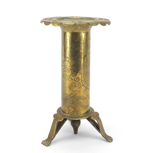 799 - Chinese brass three footed stand, engraved with a dragon, 24cm high