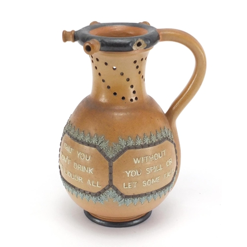 130 - Doulton Lambeth salt glazed stoneware puzzle jug, 22cm high