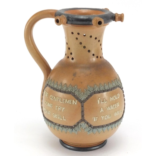 130 - Doulton Lambeth salt glazed stoneware puzzle jug, 22cm high