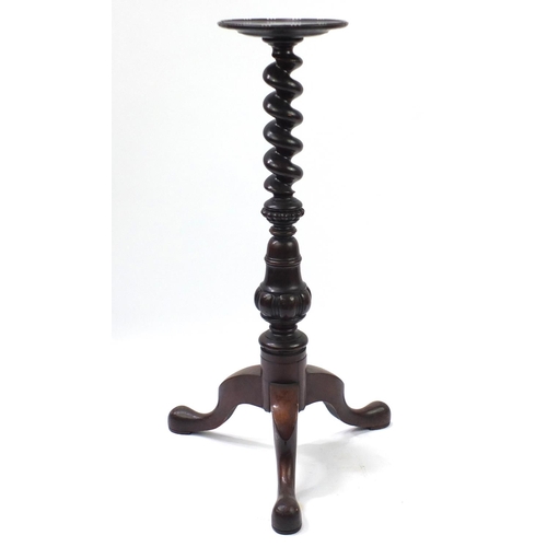24 - Carved mahogany spiral twist torchère, with tripod base, 102cm high