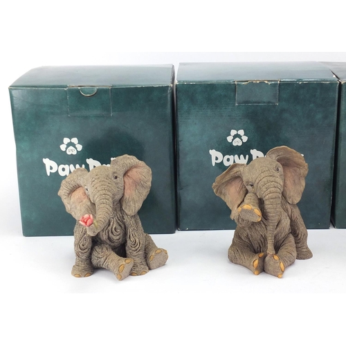 754 - Four Tuskers model elephants