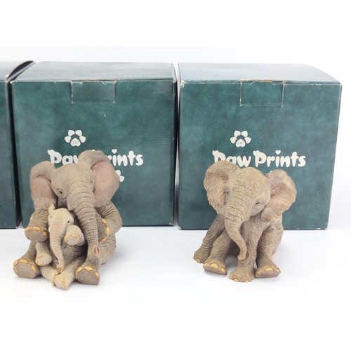 754 - Four Tuskers model elephants