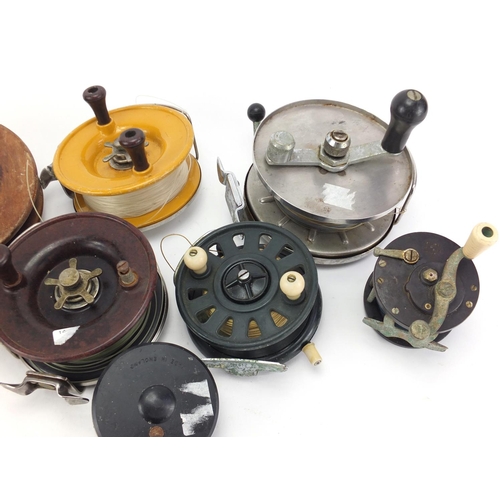 765 - Vintage sea fishing reels including Bakelite Penn number 79, Allcocks and Paramount, the largest 19c... 