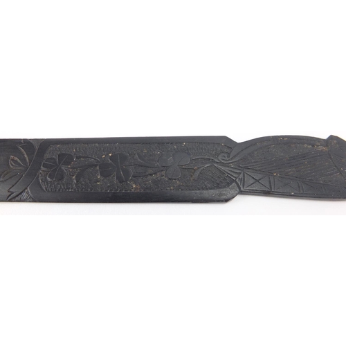 449 - Irish bog oak letter opener, carved with a harp and shamrocks, 23cm in length