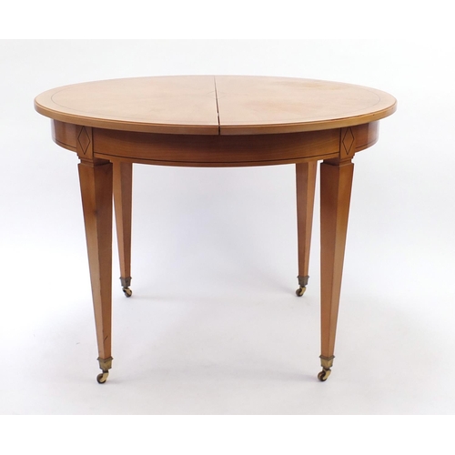 50 - Inlaid light wood circular dining table, 80cm high x 110cm in diameter
