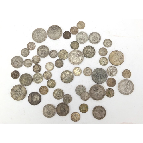 618 - Mostly British pre decimal coins, two shillings and three penny bits, approximate weight 199.0g