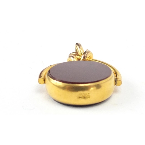 281 - Victorian style gold coloured metal hardstone spinner fob, 3cm in length