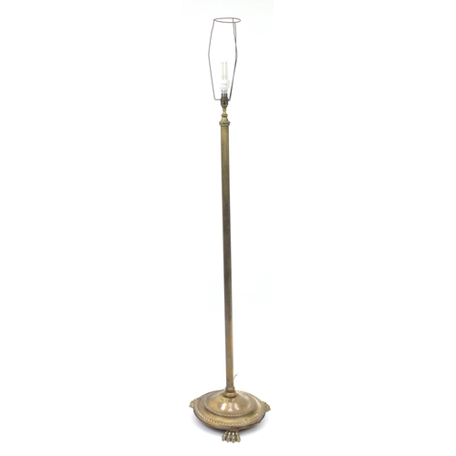 95 - Victorian brass standard lamp with paw feet, 132cm high