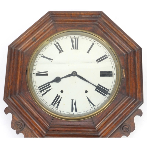 27 - Oak cased wall clock with drop pendulum and enamelled dial, 86cm high