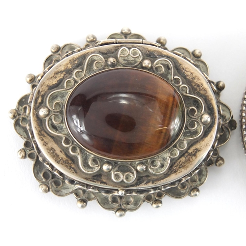 375 - Mexican silver box, the hinged lid set with a cabochon tigers eye and a circular silver compact, the... 