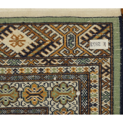 22 - Rectagular Pakistan Bokhara rug having and all over geometric design, approximately 200cm x 138cm