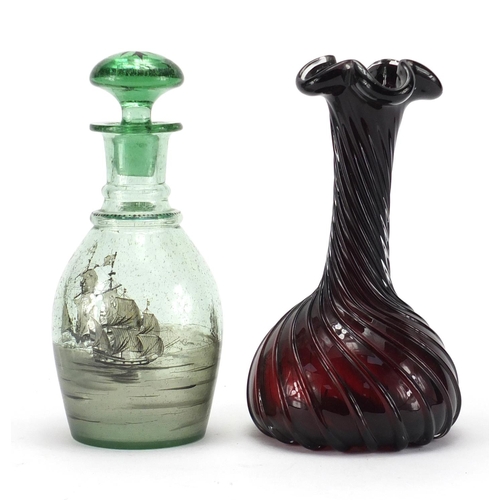 160 - Green glass decanter decorated with a ship and a red glass vase, 26cm high