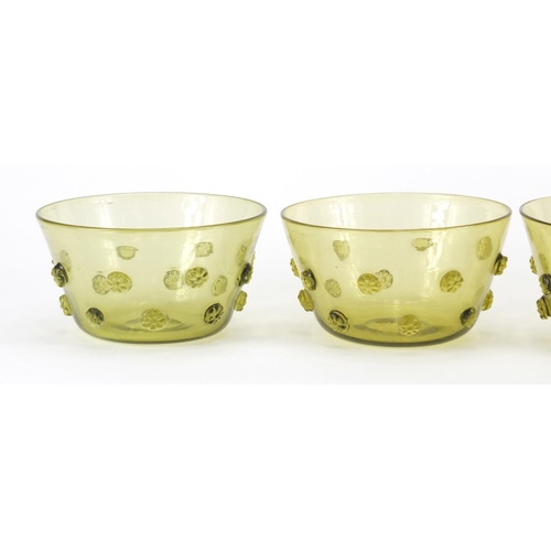 170 - Four Arts & Crafts green glass finger bowls, each 13.5cm in diameter