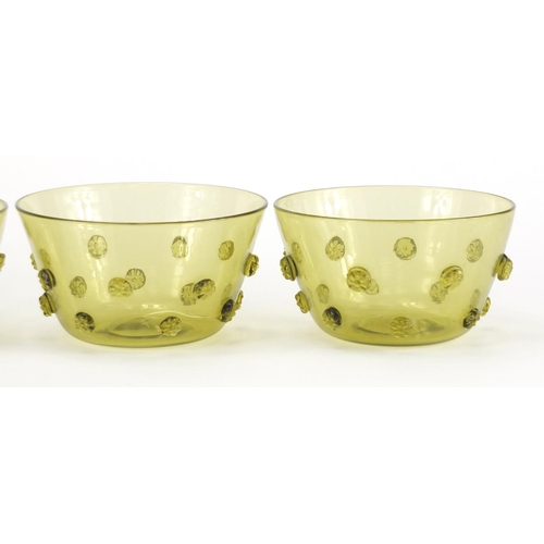 170 - Four Arts & Crafts green glass finger bowls, each 13.5cm in diameter