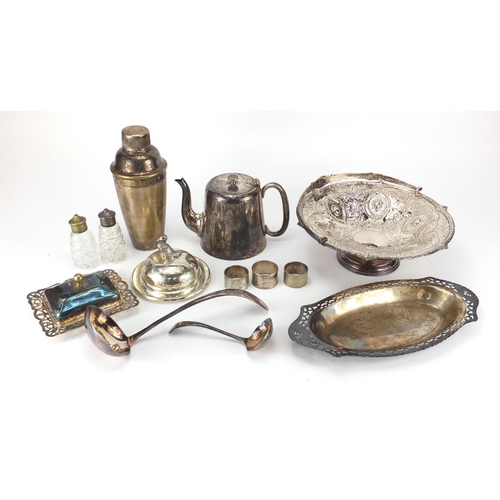 225 - Silver plated items including pedestal fruit bowl with swing handle, cocktail shaker, teapot and lad... 