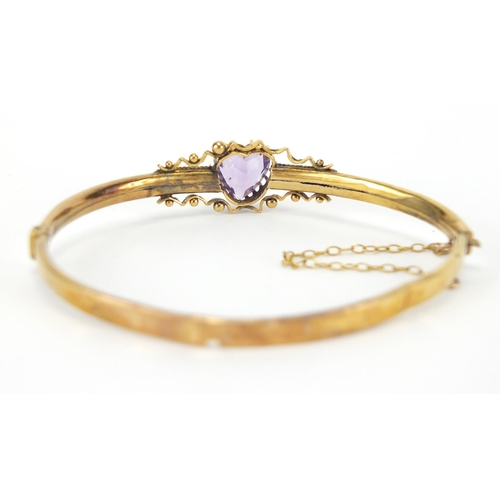 280 - Victorian gilt metal love heart amethyst and seed pearl bangle, 6cm x 5.5cm, approximate weight 5.4g