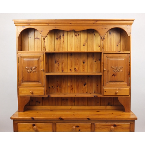 37 - Pine dresser with carved acorn motif, 202cm H x 153cm W x 46cm D