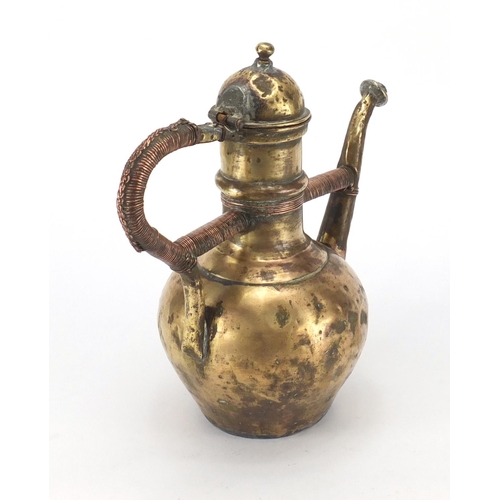 676 - Antique vessel with copper bound handle, 31cm high