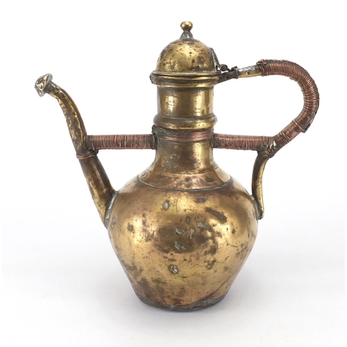 676 - Antique vessel with copper bound handle, 31cm high