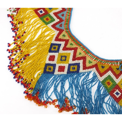 763 - African tribal beadwork apron having a geometric design, 70cm in length