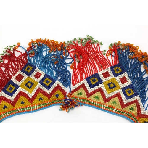 763 - African tribal beadwork apron having a geometric design, 70cm in length