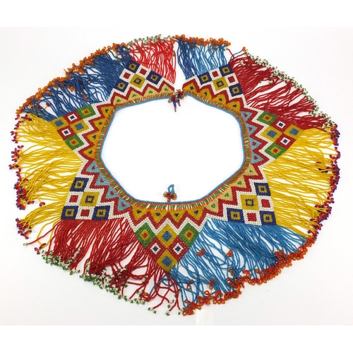 763 - African tribal beadwork apron having a geometric design, 70cm in length