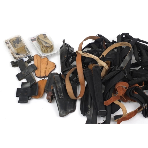 918 - Collection of mixed Military holsters and slings