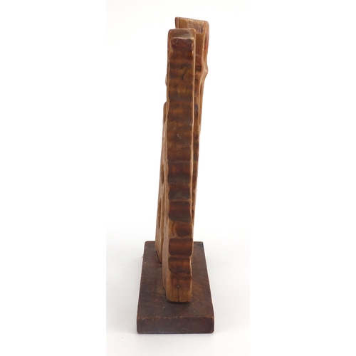 150 - Modernist carved wood sculpture on a rectangular plinth base, bearing incised marks, overall 41cm hi... 