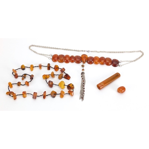 314 - Two natural amber coloured necklaces and a cheroot, approximate weight 88.0g