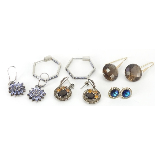 318 - Four pairs of silver earrings and a pair of gold coloured metal blue stone earrings, approximate wei... 