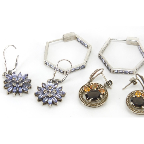 318 - Four pairs of silver earrings and a pair of gold coloured metal blue stone earrings, approximate wei... 