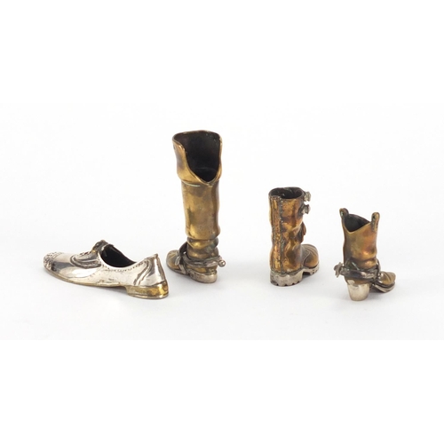 381 - Four 925 silver and brass shoes including cowboy boots, the largest 5.5cm high, approximate weight 8... 