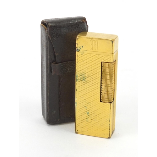 394 - Dunhill gold plated pocket lighter, with engine turned decoration and leather case