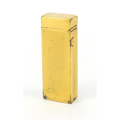 394 - Dunhill gold plated pocket lighter, with engine turned decoration and leather case