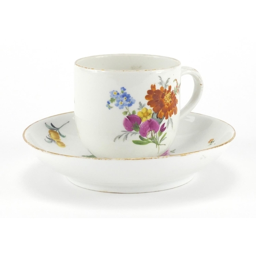 399 - Meissen porcelain cup and saucer, hand painted with flowers, the cup 7cm high