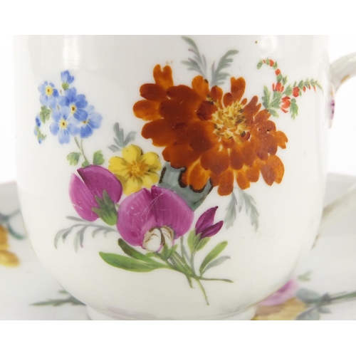 399 - Meissen porcelain cup and saucer, hand painted with flowers, the cup 7cm high