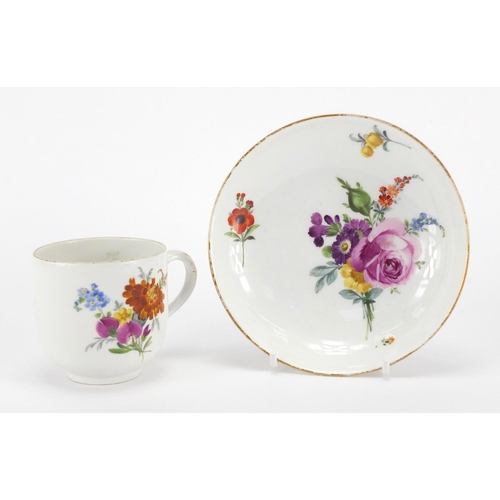 399 - Meissen porcelain cup and saucer, hand painted with flowers, the cup 7cm high