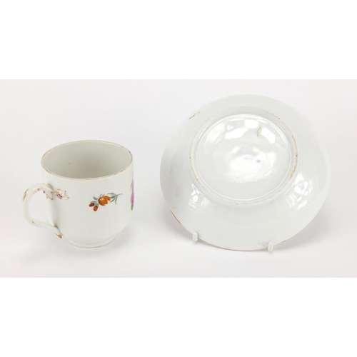 399 - Meissen porcelain cup and saucer, hand painted with flowers, the cup 7cm high