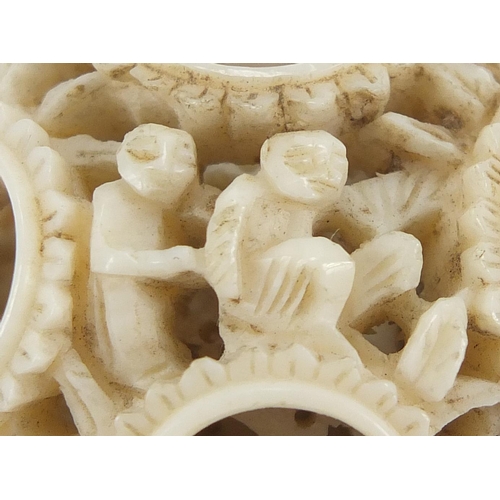 409 - Chinese Canton ivory puzzle ball and cylindrical pot, each carved with figures, the largest 4.5cm in... 