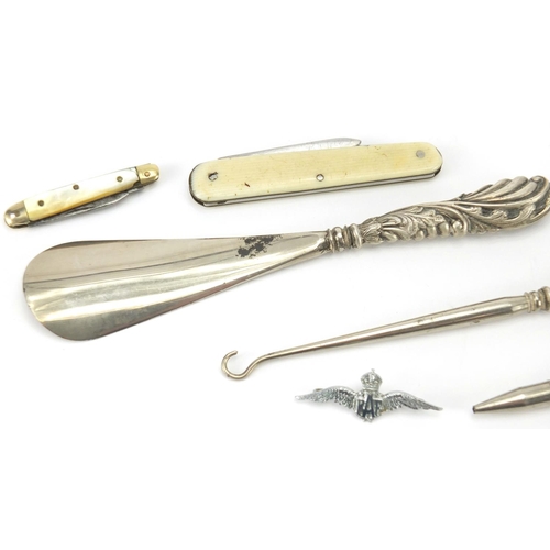 420 - Objects including silver handled button hook and shoe horn, bone flanked sewing items, pocket knives... 