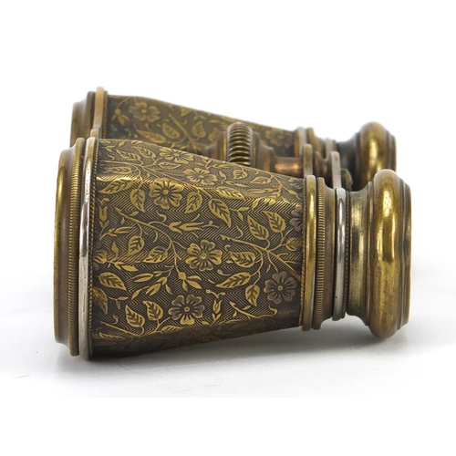 428 - Pair of Edwardian brass opera glasses with octagonal barrels, engraved with flowers, 11cm wide