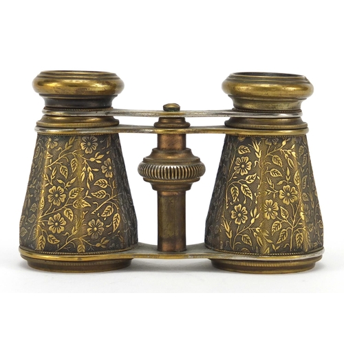 428 - Pair of Edwardian brass opera glasses with octagonal barrels, engraved with flowers, 11cm wide