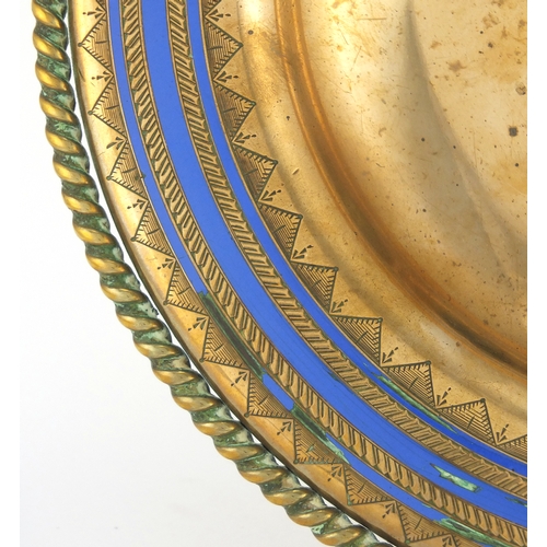 471 - Gilt copper and blue enamel wall hanging, with central star motif, probably Ottoman, 26cm in diamete... 